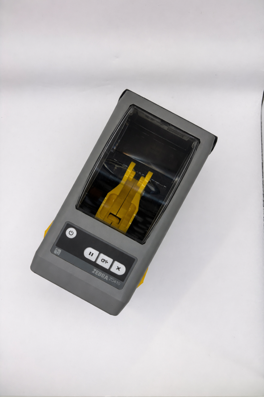 Top view of Zebra ZD410 direct thermal printer showing buttons and status indicators